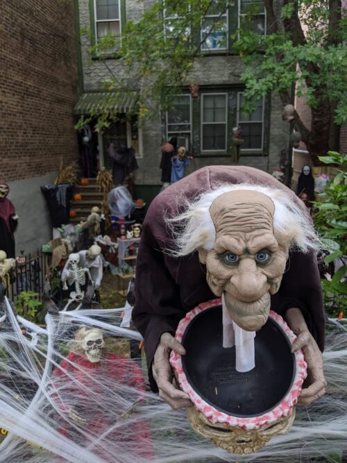 Row house decorated with gremlins for Halloween, a popular holiday. Celebrated to the fullest in New York.